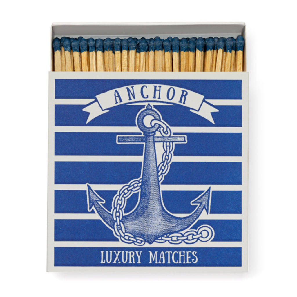 Archivist Gallery Anchor square match box with blue and white anchor illustration, slid open slightly to see blue-tipped wood 4 inch matches inside.