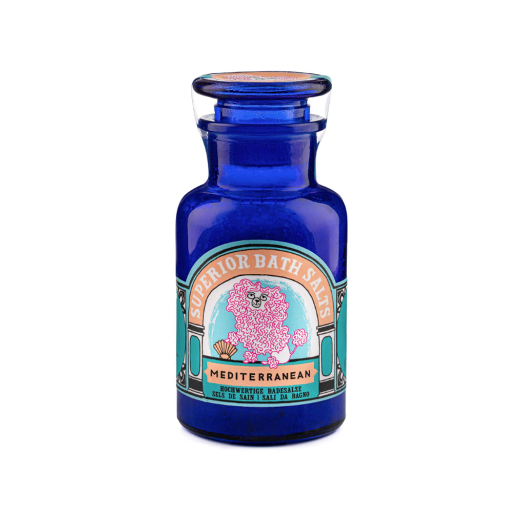Archivist Gallery Mediterranean scented bath salts in blue bottle packaging with teal and orange label with a pink poodle illustration, front view.