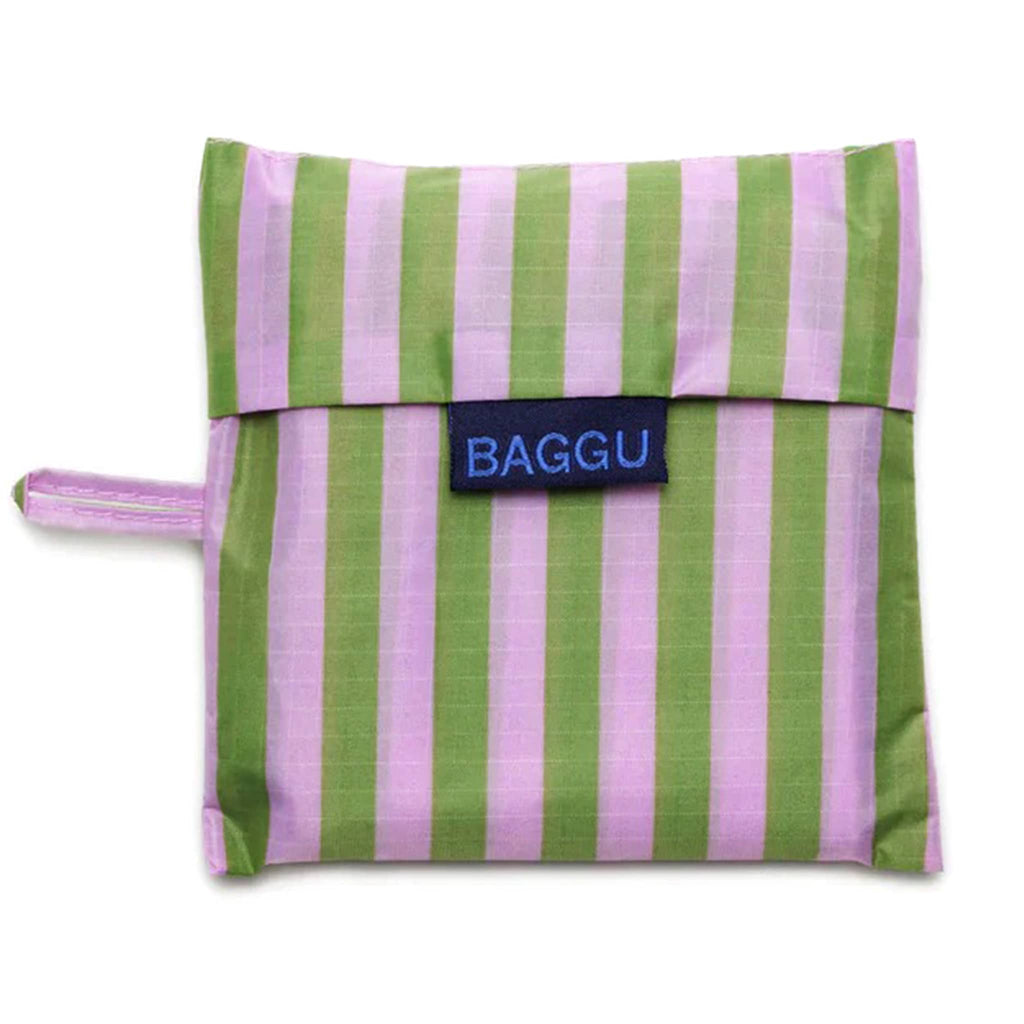 Baggu standard size eco-friendly recycled ripstop nylon reusable tote bag with lilac and green avocado candy stripe print, in matching pouch.