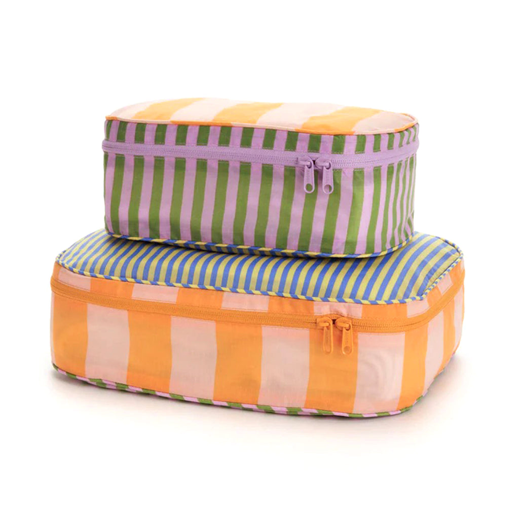 Baggu reusable recycled ripstop nylon packing cube set of 2, both sizes have the colorful hotel stripes prints, stuffed and stacked.