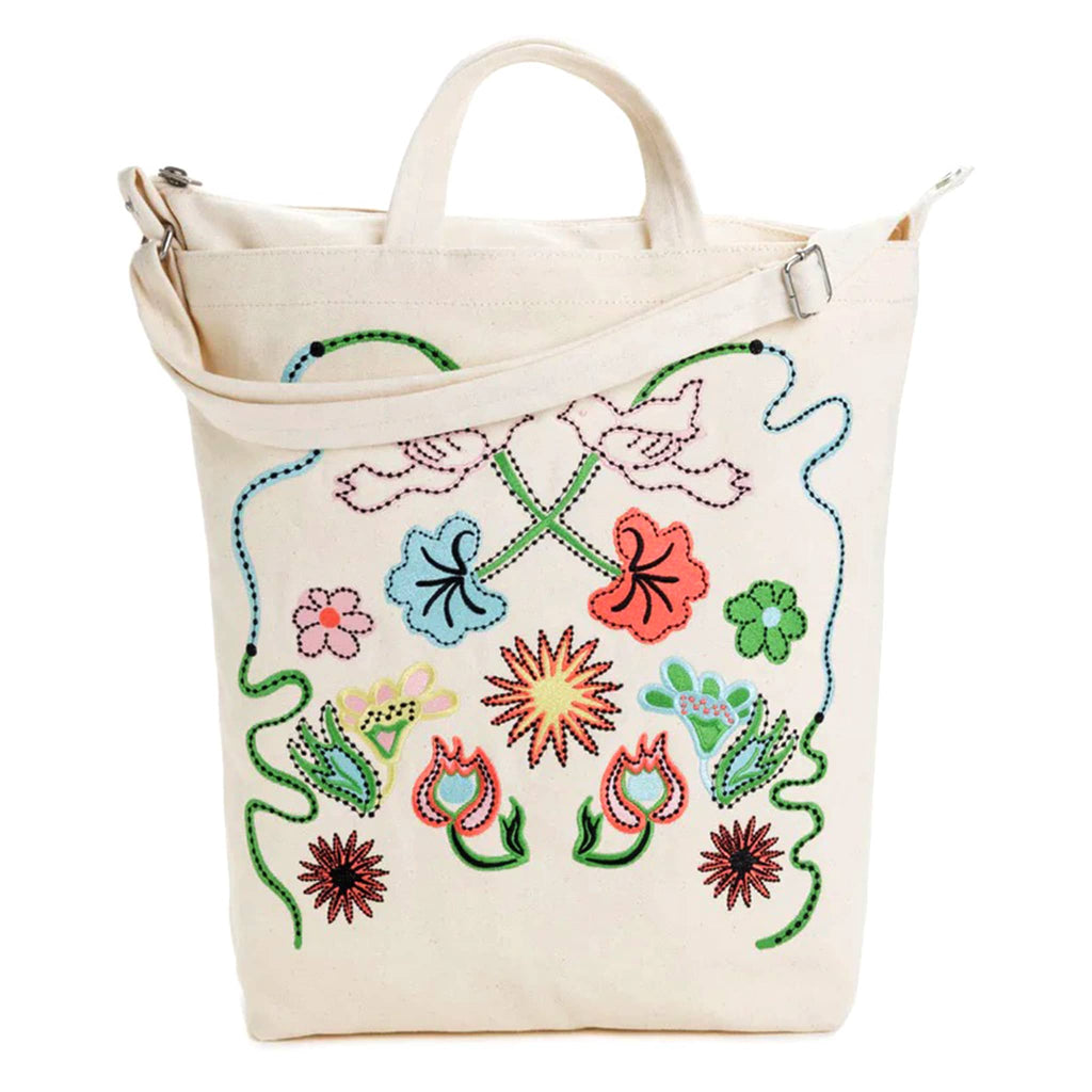 Baggu recycled cotton canvas duck bag tote with zip top closure in a cream color with colorful embroidered birds and flowers, front view.