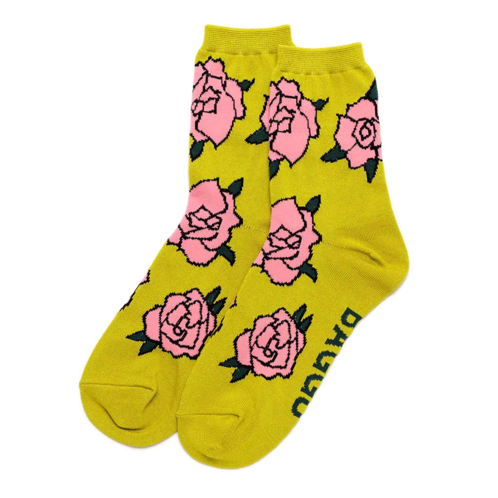 Baggu bamboo rayon unisex crew socks with pink roses on a lemongrass background, flat.