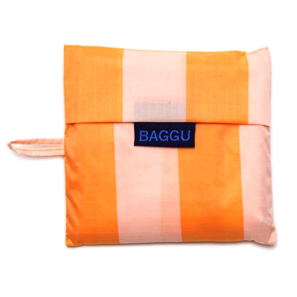 Baggu standard size eco-friendly recycled ripstop nylon reusable tote bag in Tangerine Wide Stripe, in matching pouch.