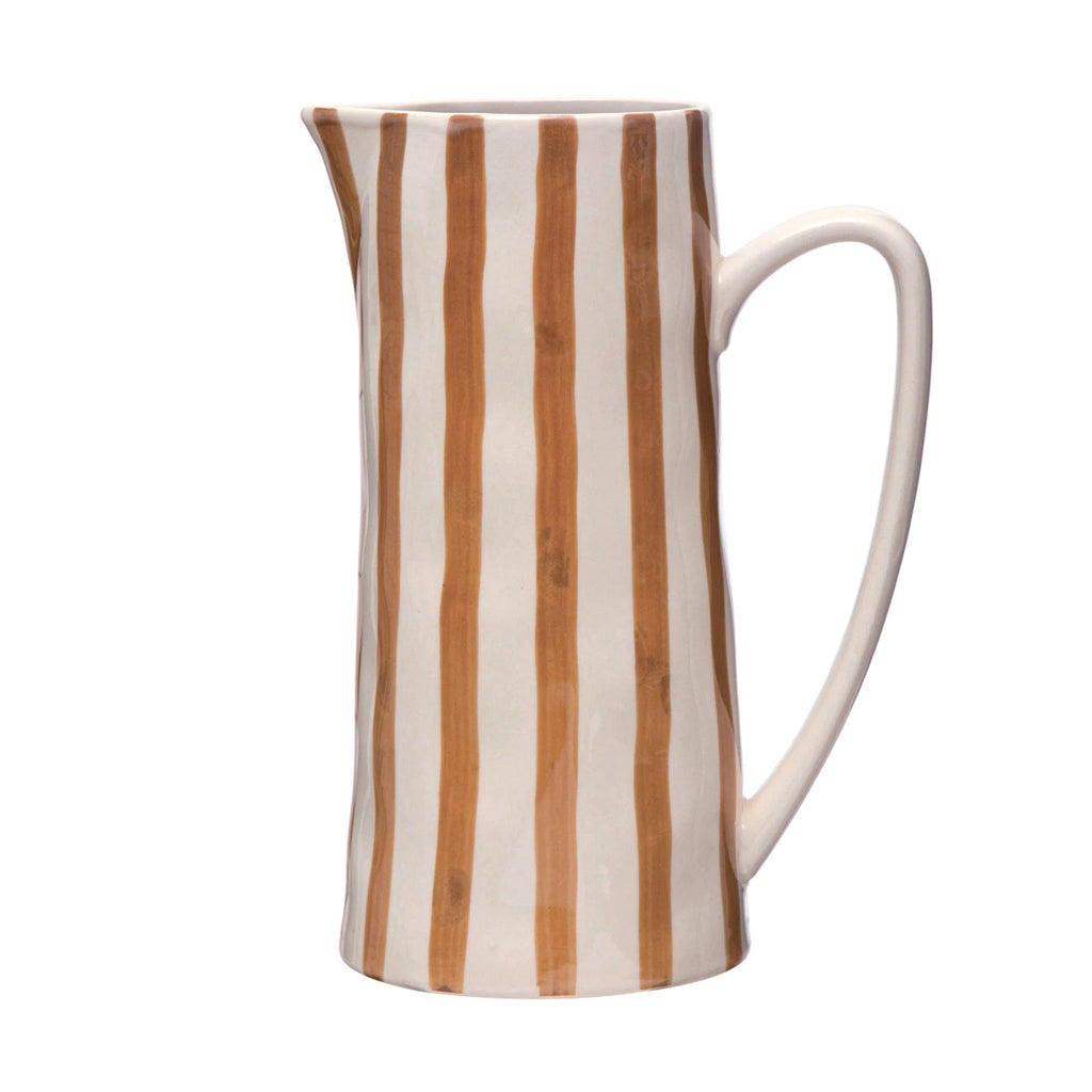 Creative Co-op Hand-Painted White and Brown Striped Stoneware Serving Pitcher, spout is on the left, handle is on the right.