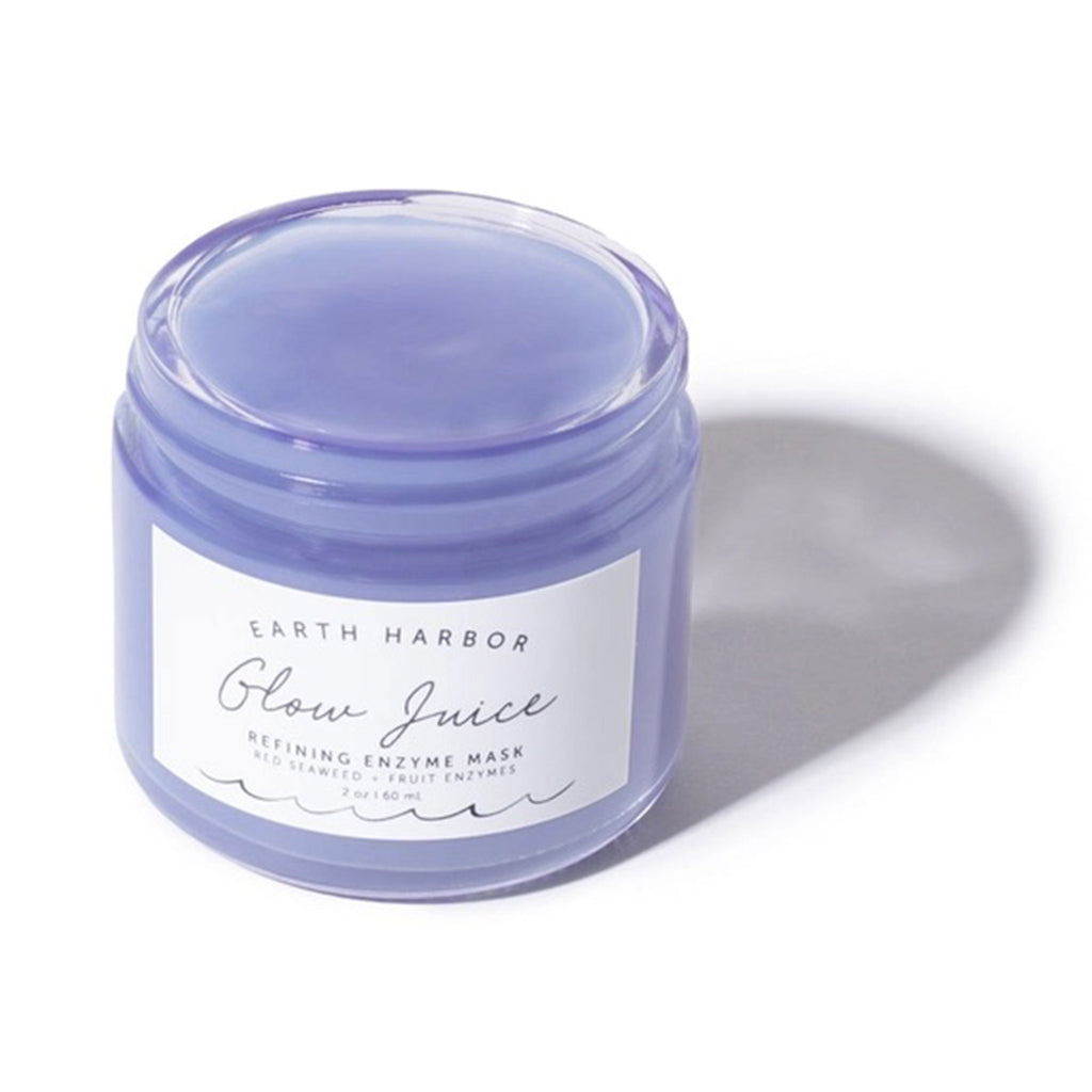 Earth Harbor Glow Juice Refining Enzyme Mask in glass jar, front view with lid off.