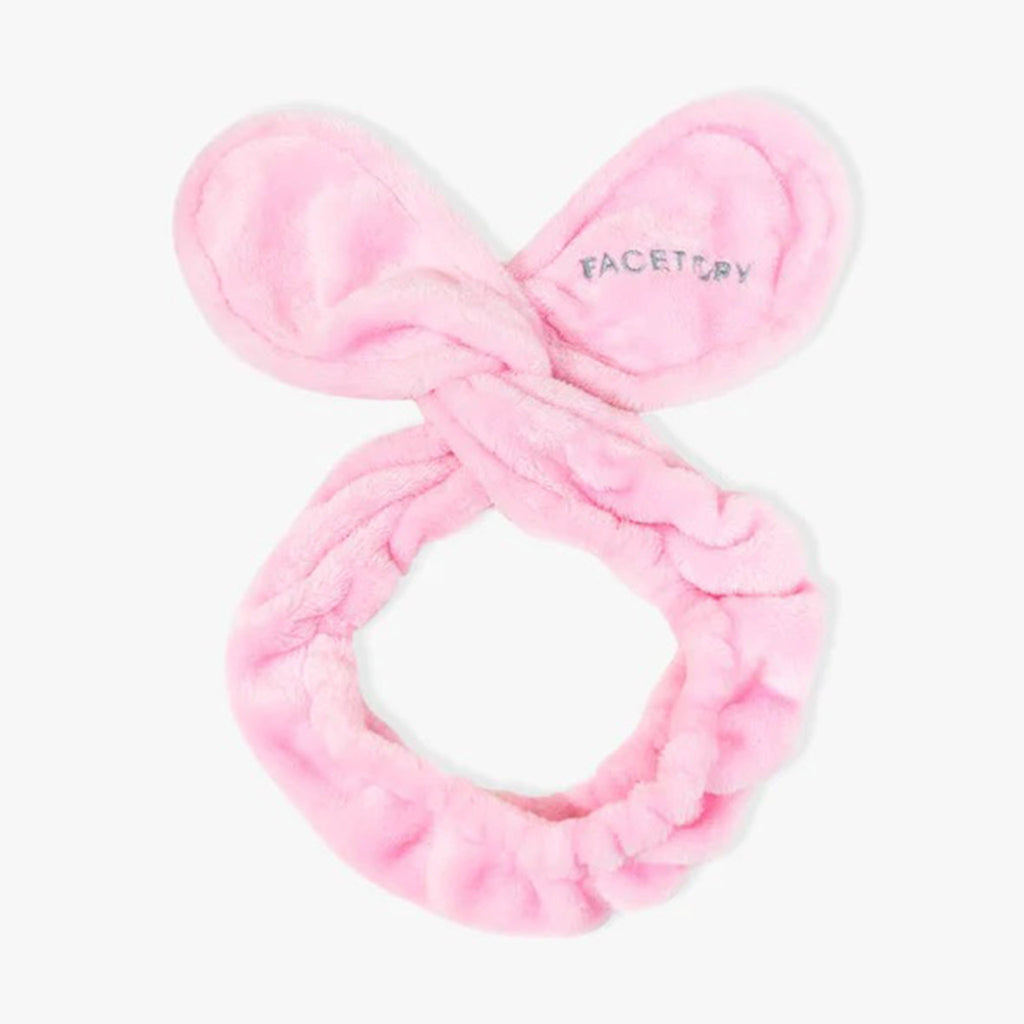 Facetory Tory Twist Bunny Hair Band in blush pink with logo on one "ear".