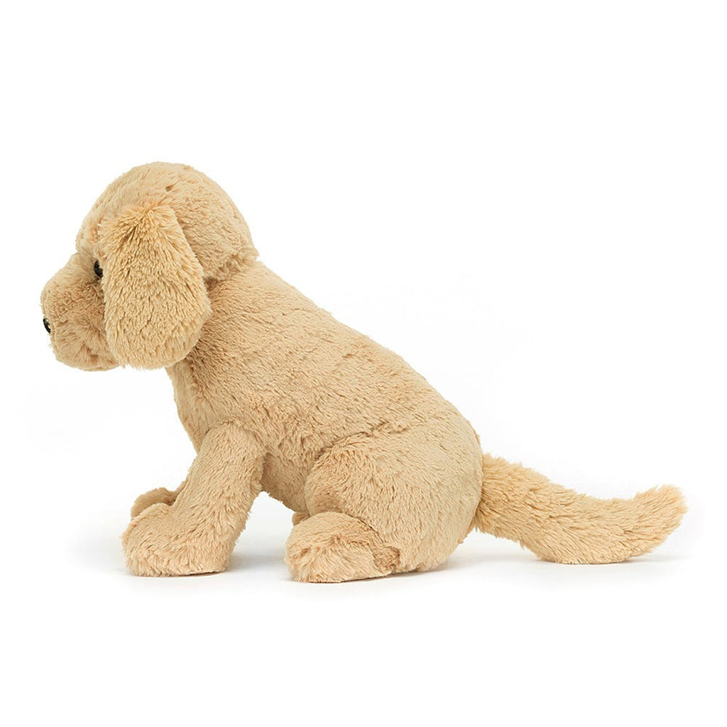 jellycat Tilly Golden Retriever plush toy with tan fur, black bead eyes and a black nose, side view.