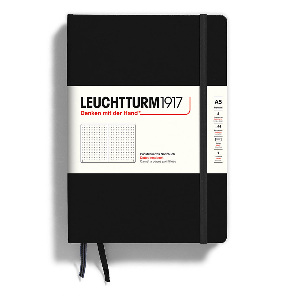 Leuchtturm1917 hardcover A5 medium notebook with dotted pages and a black cover and elastic band.