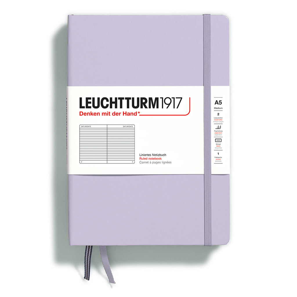 Leuchtturm1917 hardcover A5 medium notebook with ruled pages and a lilac cover and elastic band.