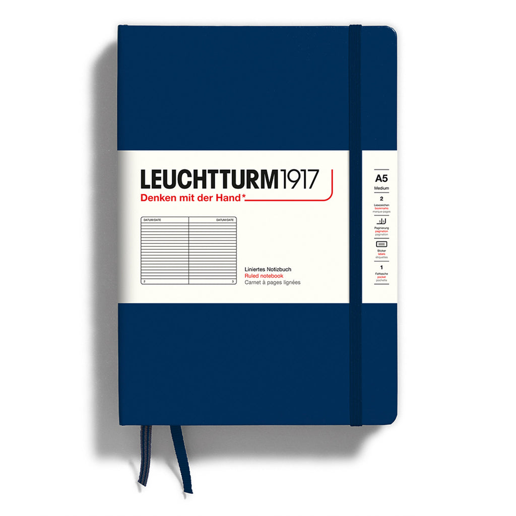 Leuchtturm1917 hardcover A5 medium notebook with ruled pages and a navy blue cover and elastic band.