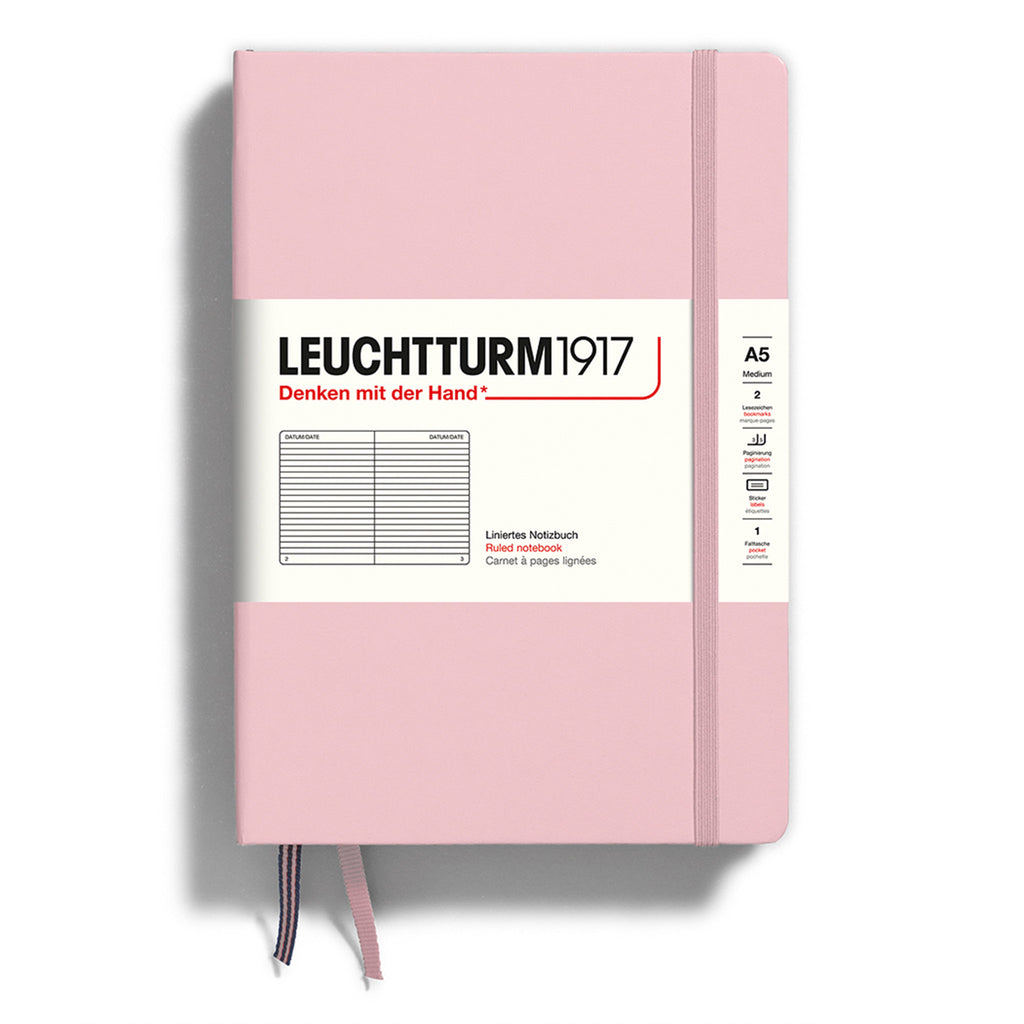 Leuchtturm1917 hardcover A5 medium notebook with ruled pages and a powder pink cover and elastic band.