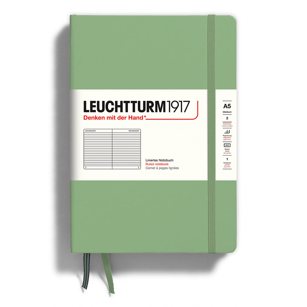 Leuchtturm1917 hardcover A5 medium notebook with ruled pages and a sage green cover and elastic band.