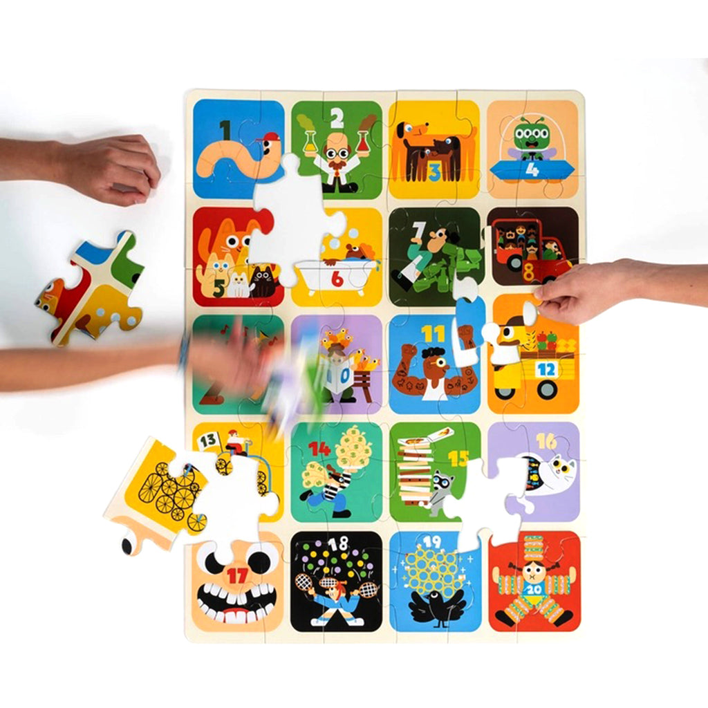 Nolja Play 36 piece easy as 1, 2, 3 jigsaw puzzle in progress with hands placing pieces.