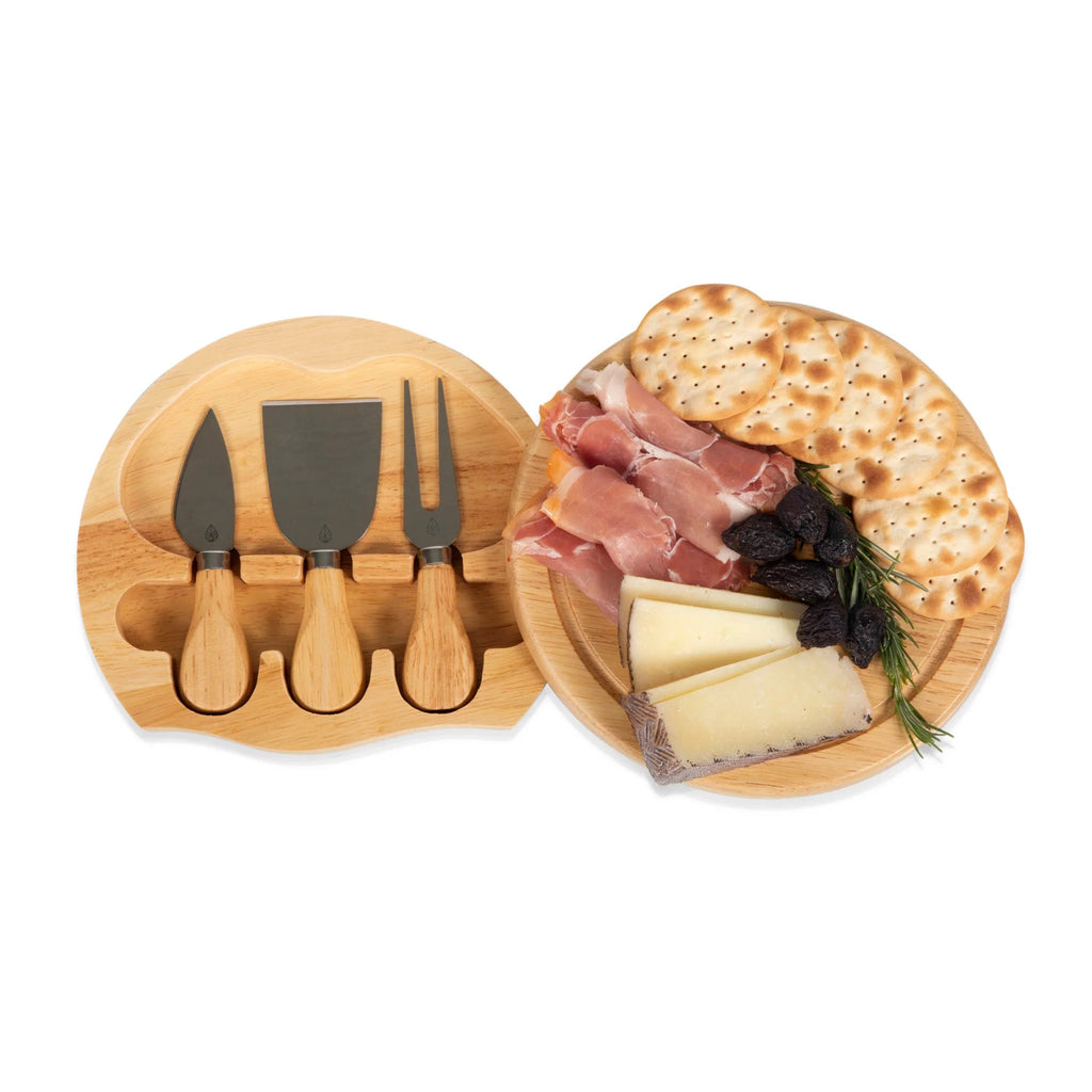 Picnic Time Toscana Brie Cheese Cutting Board and Cheese Tools Set, round parawood board swiveled open to show tools hidden inside with prosciutto, cheese and crackers on top.