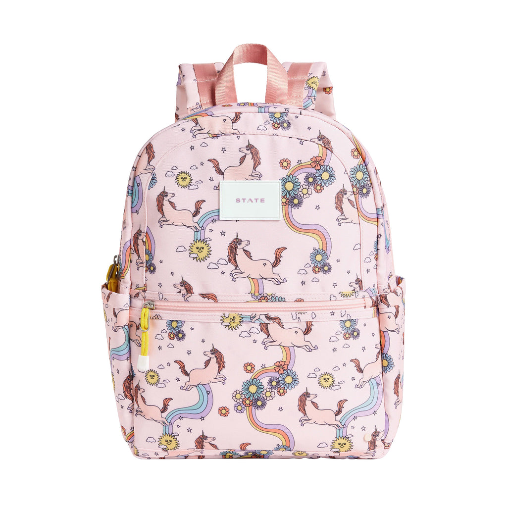 State Bags Kane Kids Recycled Poly Canvas Backpack in Unicorn with colorful pastel rainbows, flowers and unicorns on a pink background, front view.