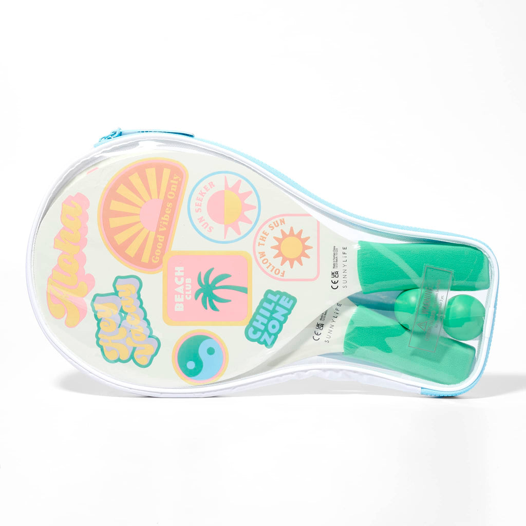 Sunnylife Summer Sherbet Beach Bats with colorful california girl graphics, green soft grips and green balls in clear carrying case, front view.