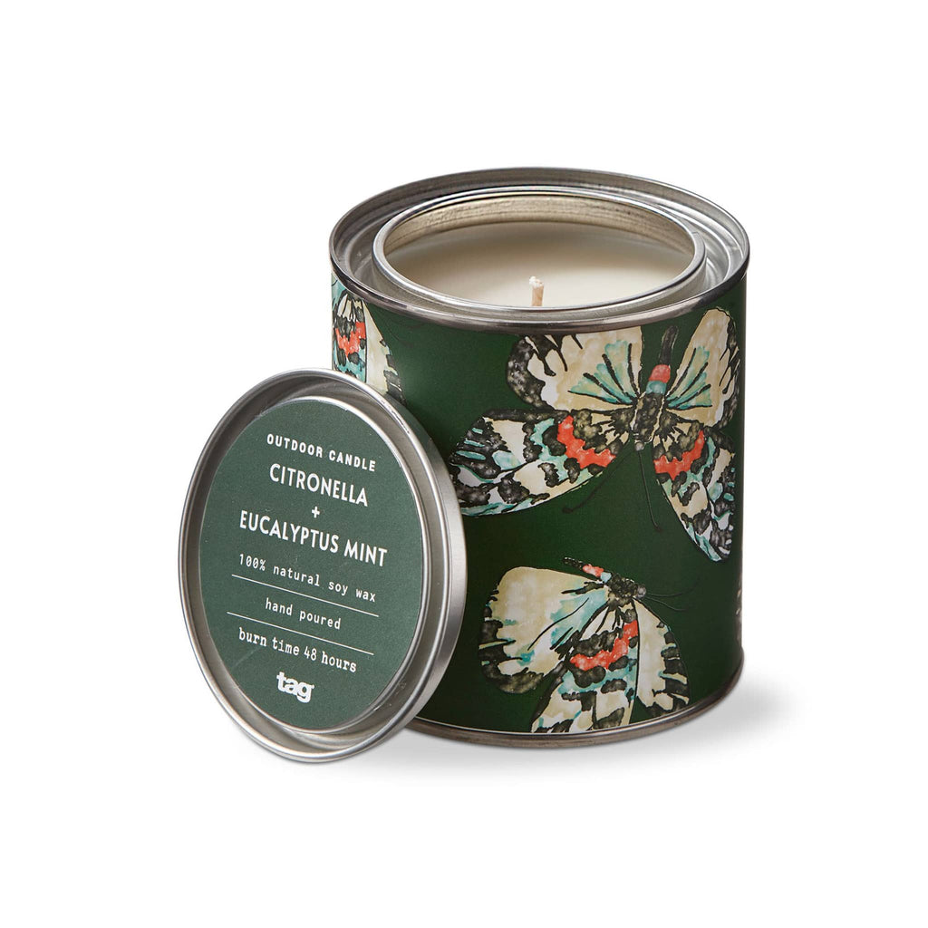 Tag Limited Citronella and Eucalyptus Mint scented soy wax candle in dark green tin with butterfly print, lid off.