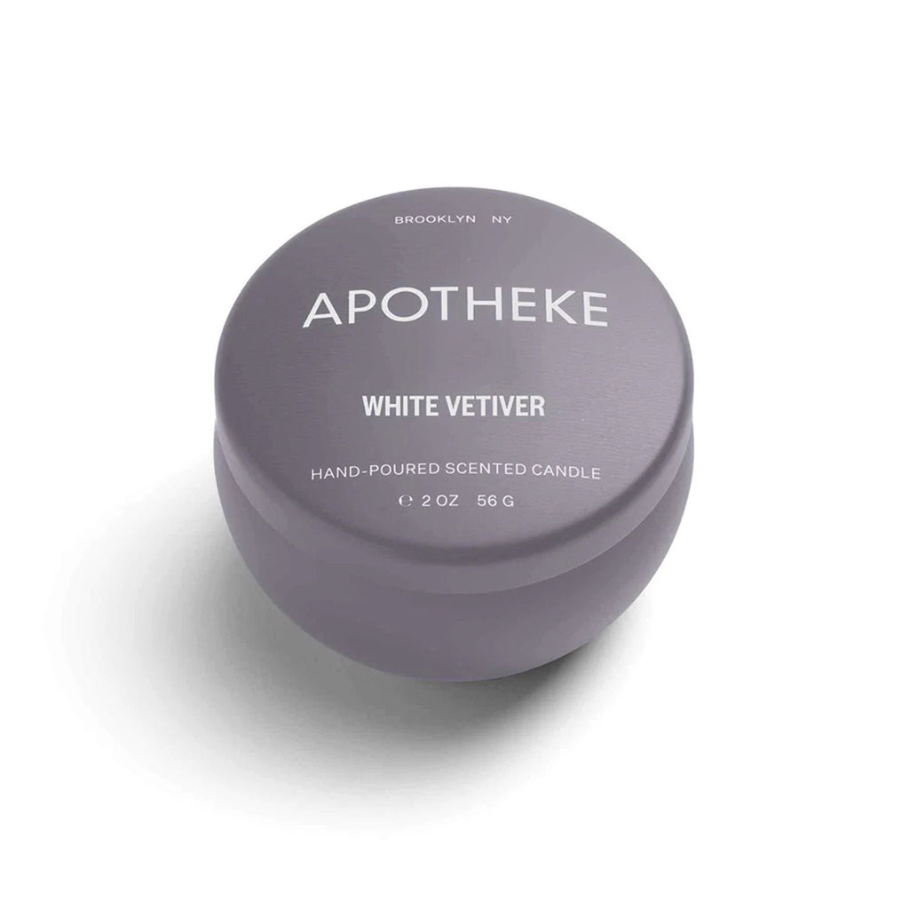 Apotheke White Vetiver scented soy wax blend candle in mini dark gray tin with lid.