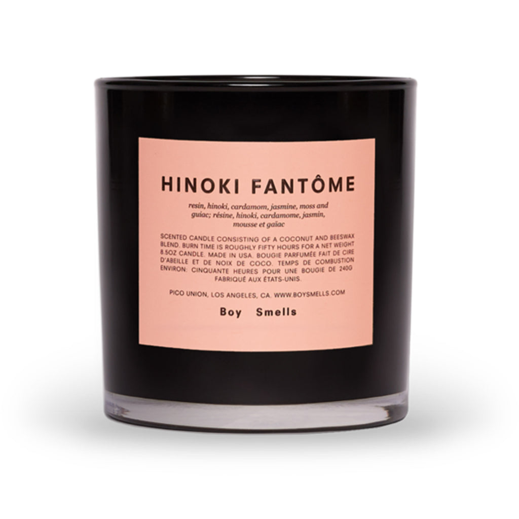 boy smells hinoki fantome scented candle in black glass tumbler