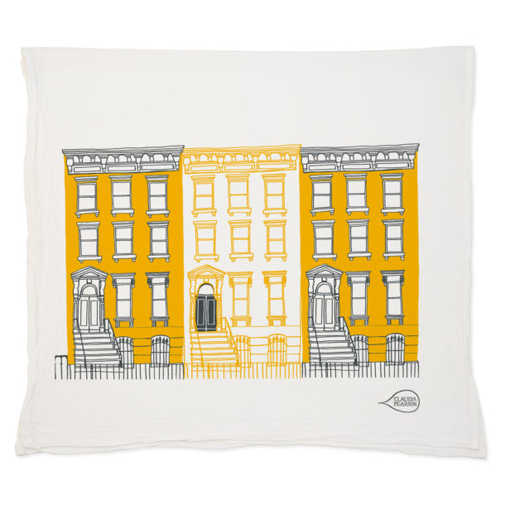 off-white flour sack cotton towel with a row of 3 classic brownstones with stoops in a yellow and black color palette