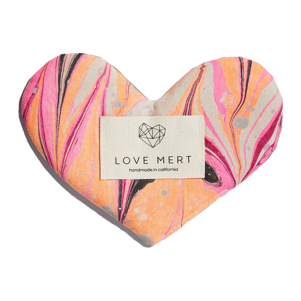 love mert heart shaped love eye pillow in electric color scheme with neon orange, neon pink and black swirls