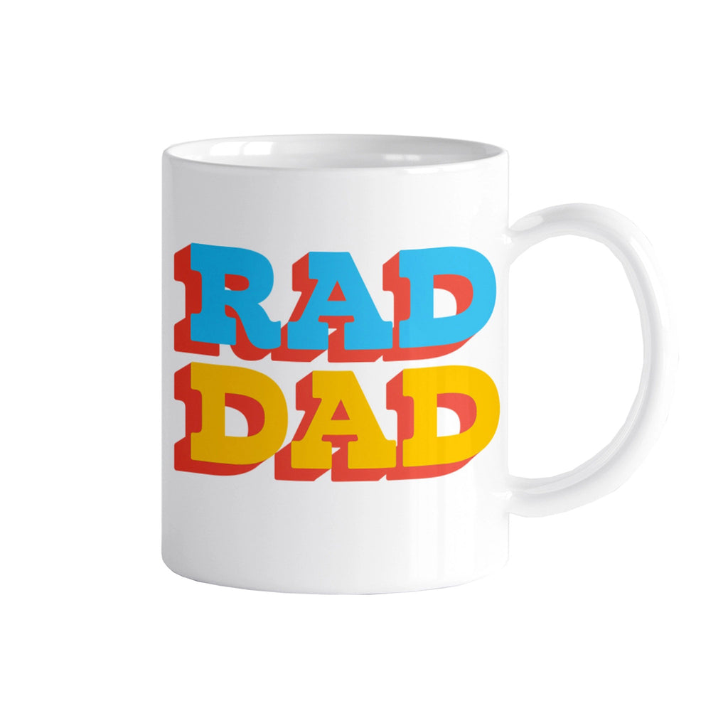 Rock Scissor Paper white ceramic coffee mug with "rad dad" in blue and red block letters with red shadow.
