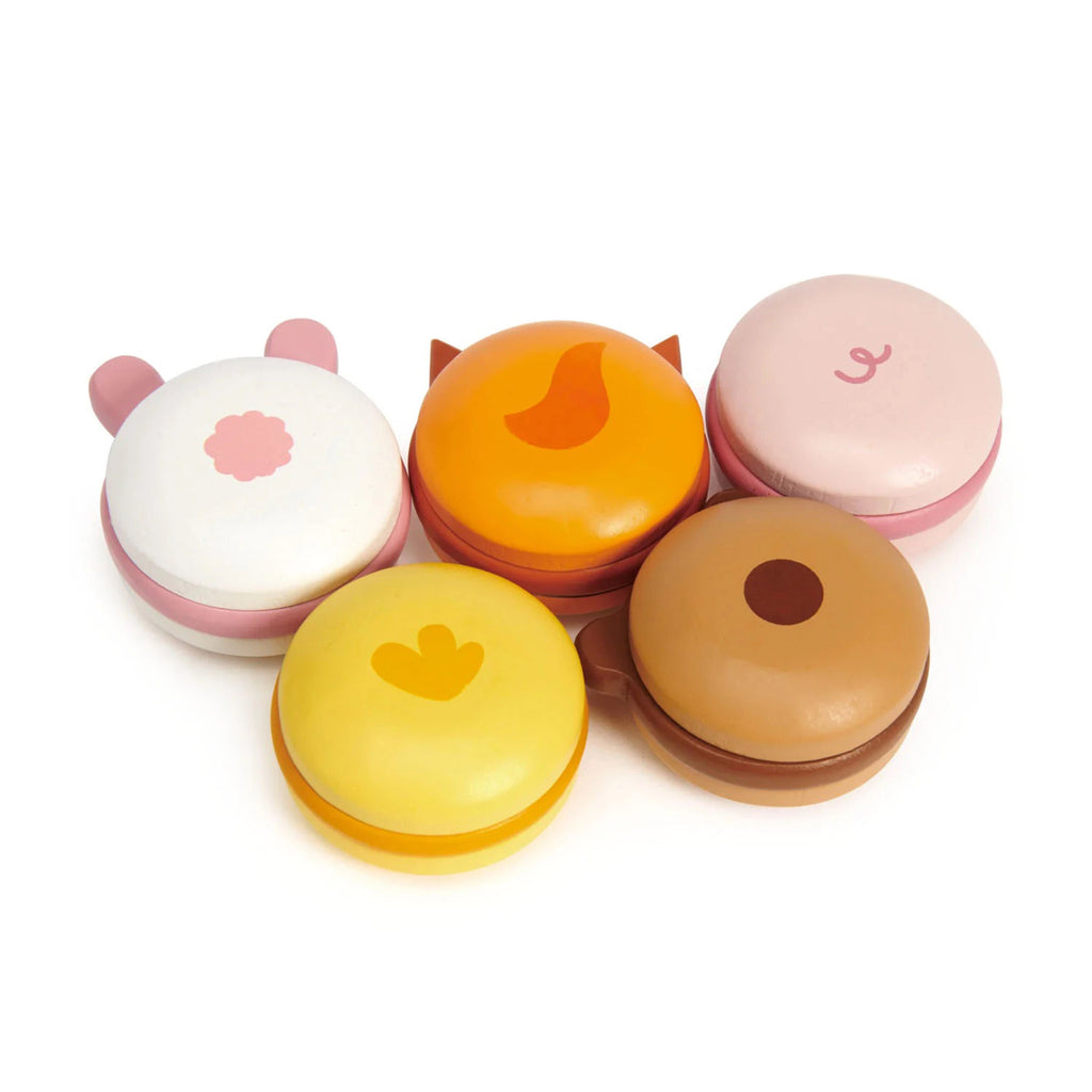 Painted wooden animal macarons set with a bear, chick, bunny, fox and pig, bottom view of all.