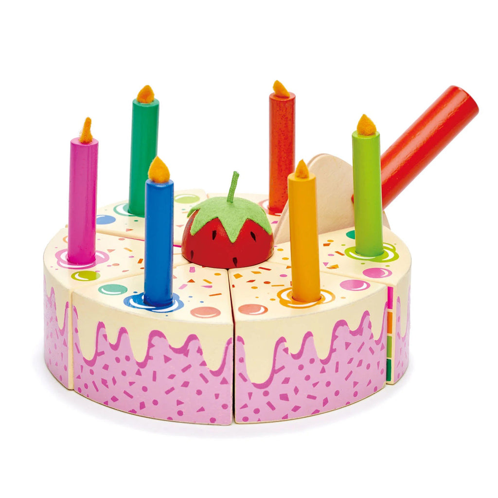 Wooden rainbow cake with colorful wood candles with felt "flames" and a wood cake server.