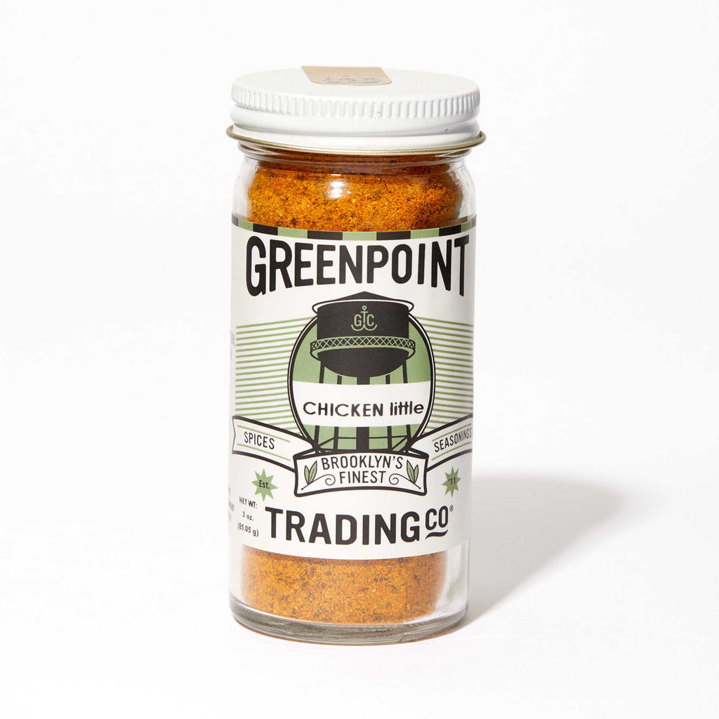 Greenpoint Trading Co Chicken Little poultry and vegetable seasoning blend in glass jar, front view.