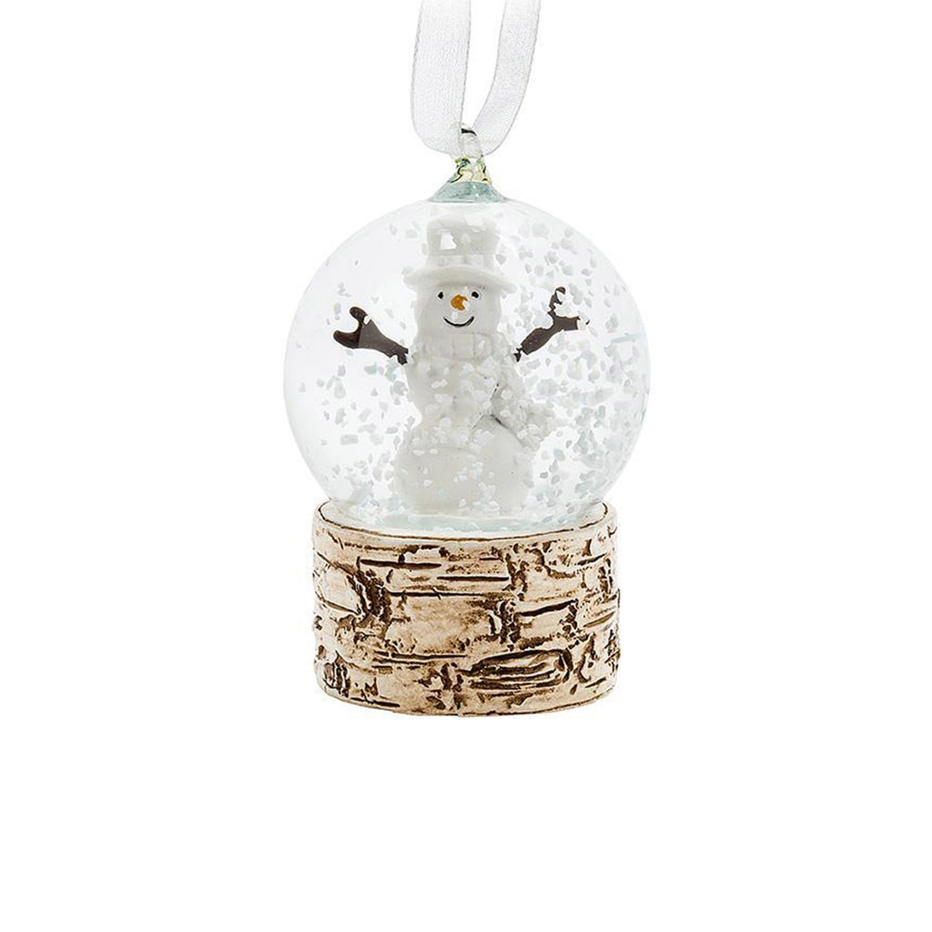 Abbott small clear snow globe with smiling snowman sits on a faux-birch base with ribbon hanger.