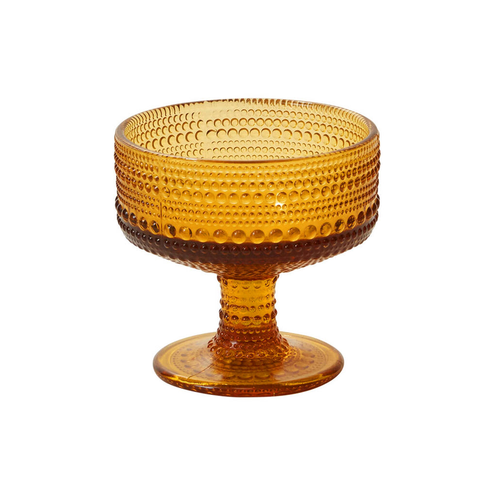 Accent Decor Pomona coupe glass in amber with raised dot pattern.