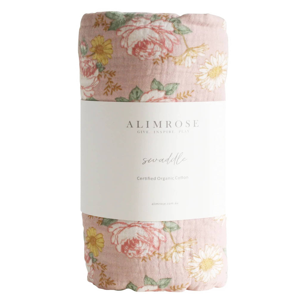 Alimrose English Garden organic cotton muslin baby swaddle, rolled up with bellyband packaging.