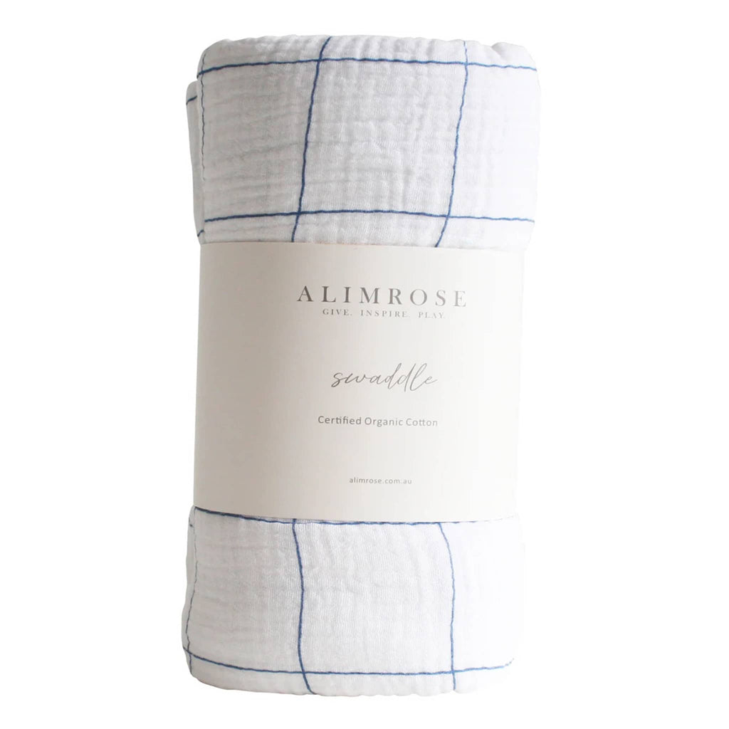 Alimrose Grid Navy organic cotton muslin baby swaddle, rolled up with bellyband packaging.