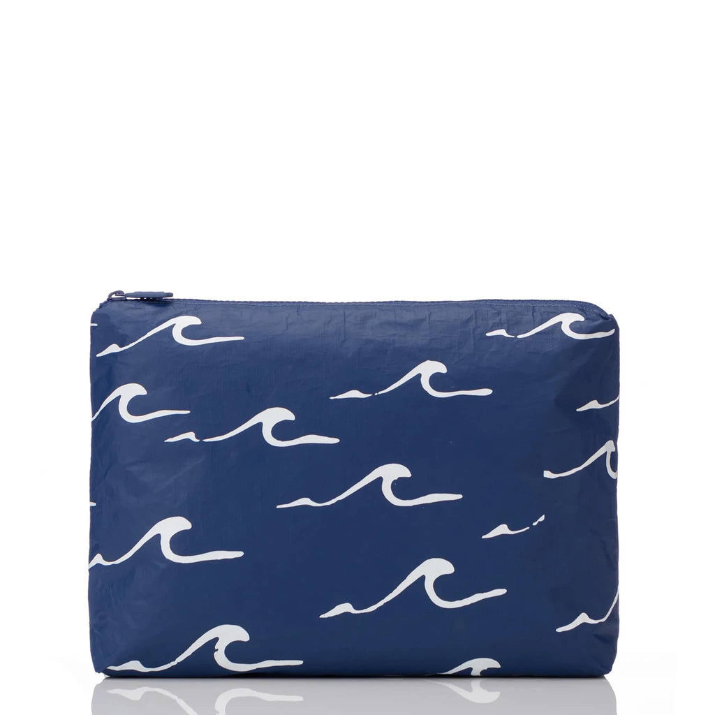 Aloha Collection Seaside medium splash-proof zip pouch with white cresting waves print on a navy backdrop, front view.