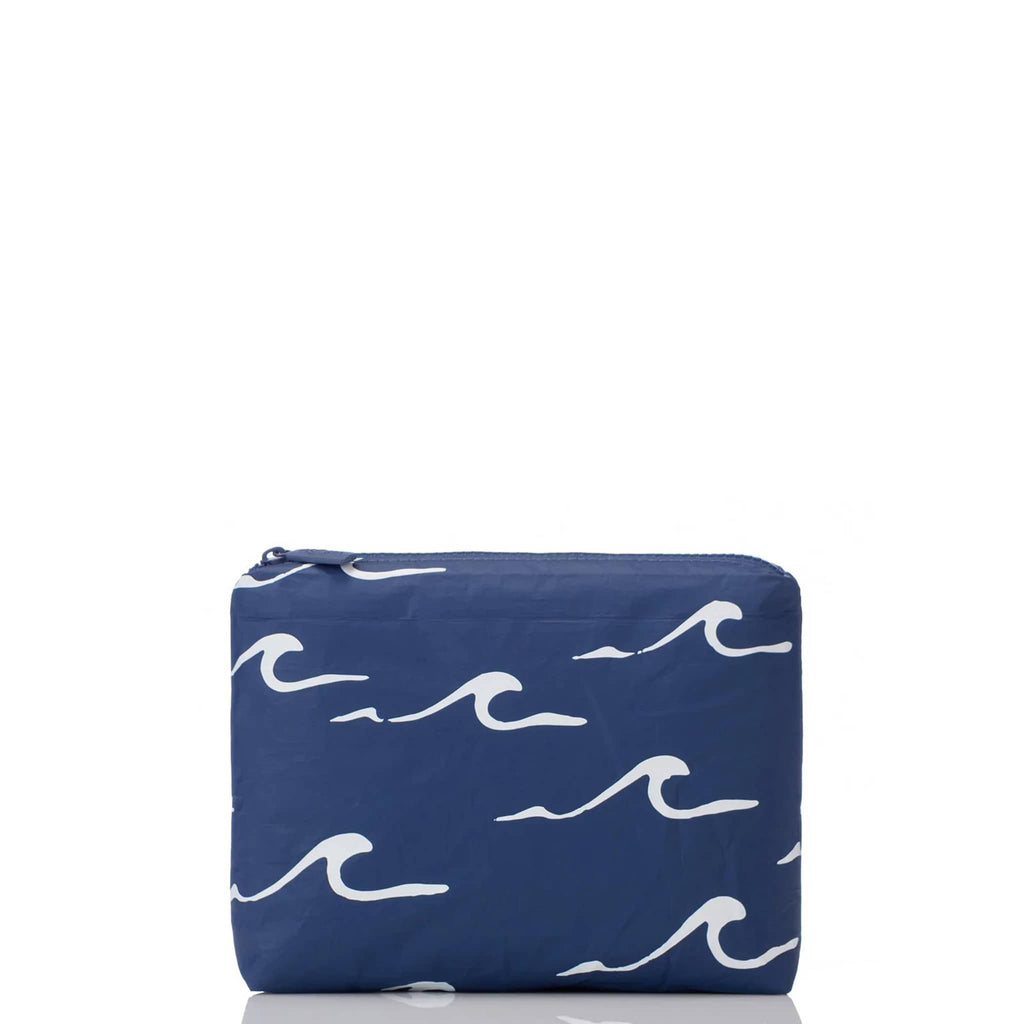 Aloha Collection Seaside small splash-proof zip pouch with white cresting waves print on a navy backdrop, front view.