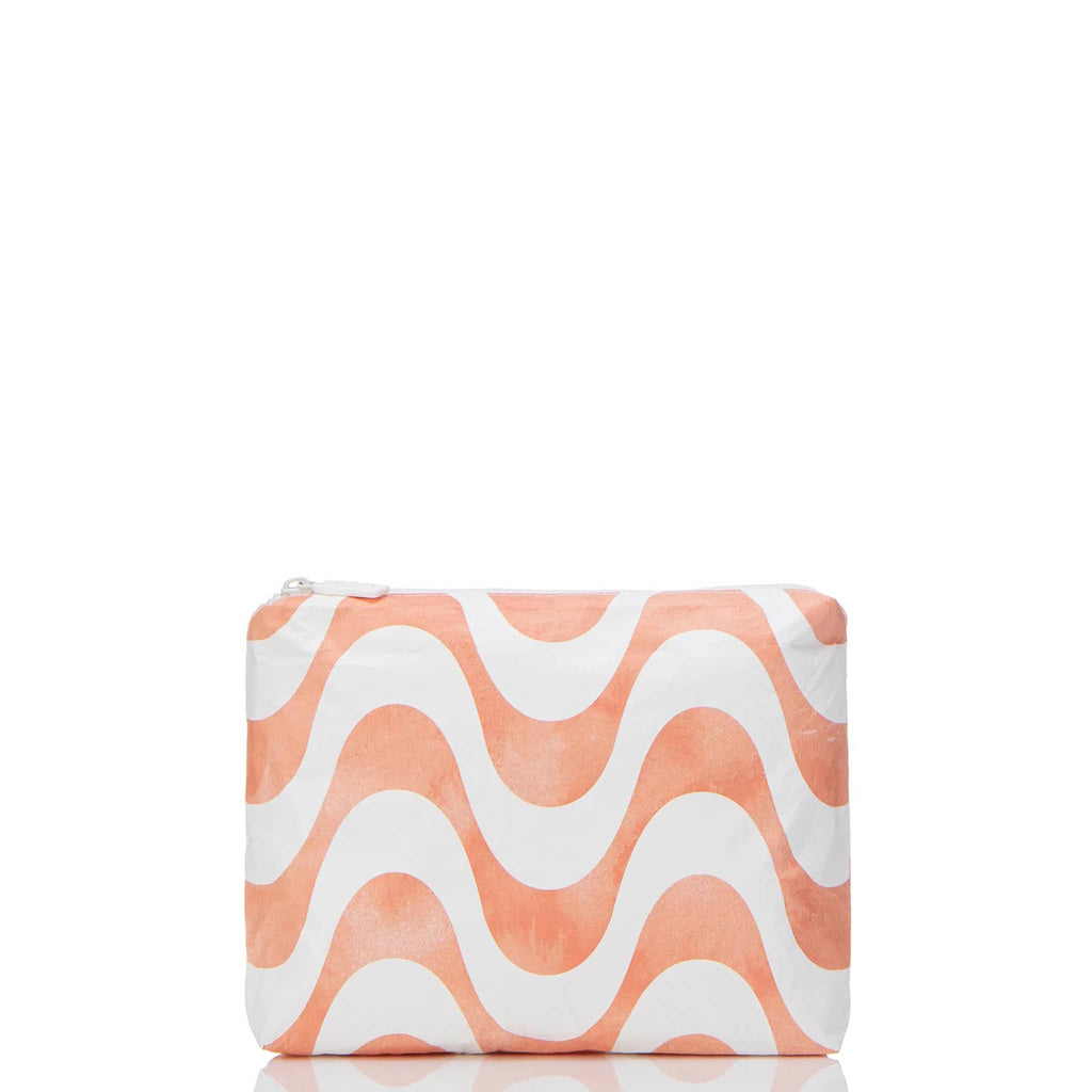 Aloha Collection Coral Splash Calcada small splash-proof zip pouch with pale orange and white horizontal wave pattern, front view.
