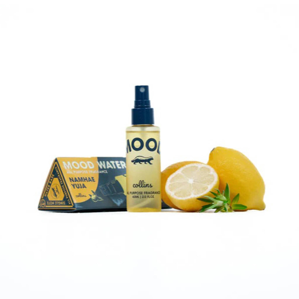Collins Mood Water Fragrance Spray in Namhae Yuja, bottle and lemons with packaging on a white background.