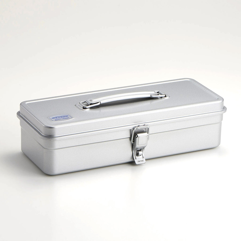 Ameico TOYO T-320 silver steel toolbox with top handle and flat lid. Angled view shows the front, top and side views.
