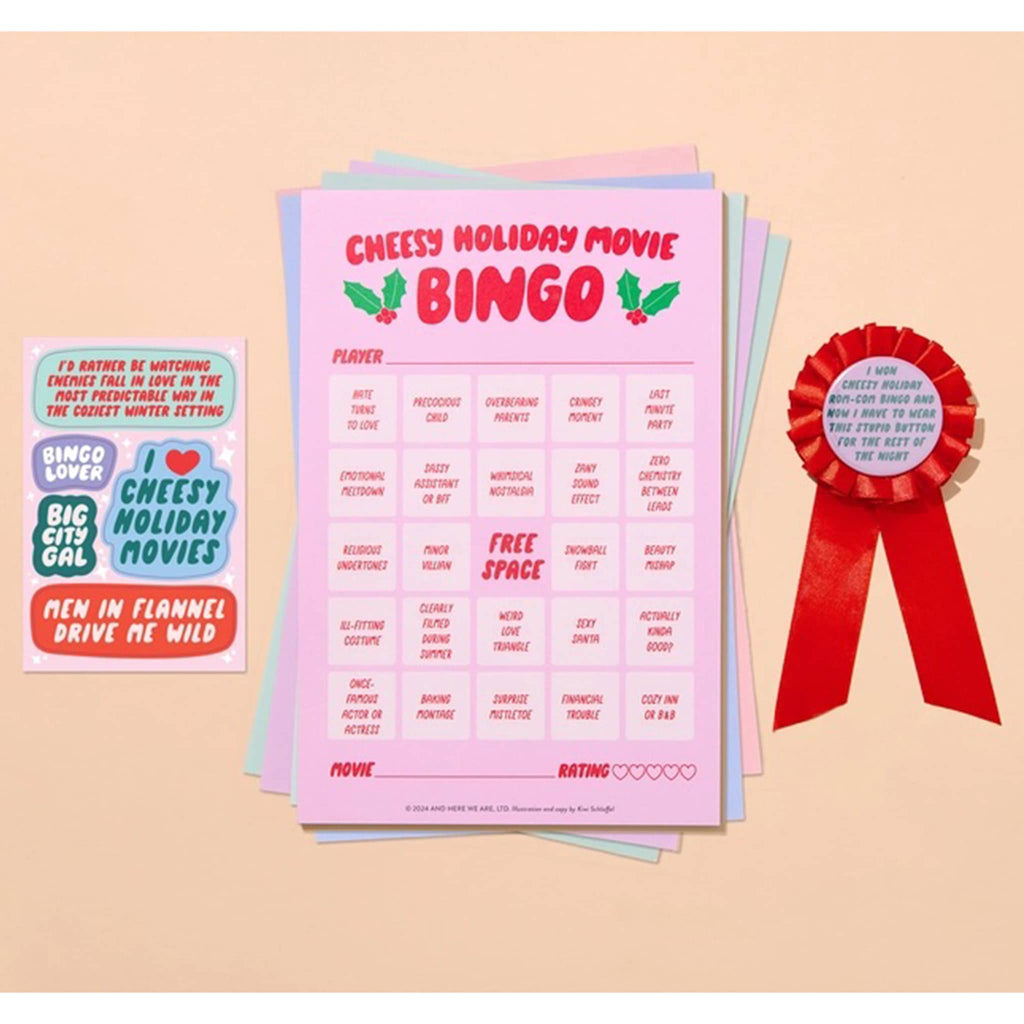 And Here We Are Cheesy Holiday Movie Night Bingo game contents including stickers, game boards and a 1st place ribbon.