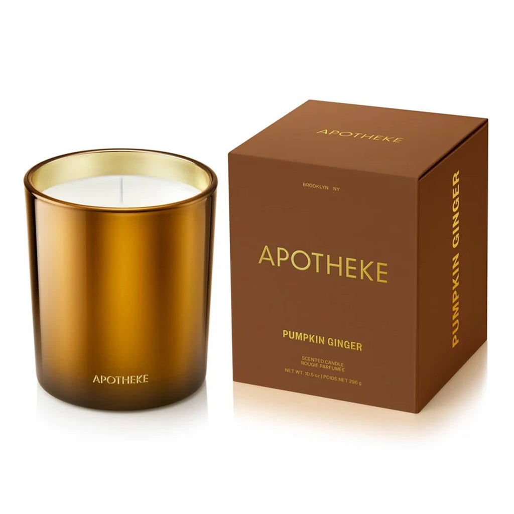 Apotheke 10.5 ounce Pumpkin Ginger scented soy wax blend candle in bronze glass vessel with gold interior, next to matching gift box with gold lettering.