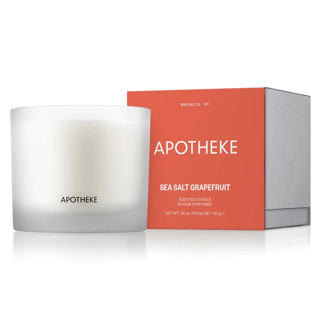 Apotheke 3-wick Sea Salt Grapefruit scented soy wax blend candle in matte white translucent glass vessel with orange and white gift box, front view.