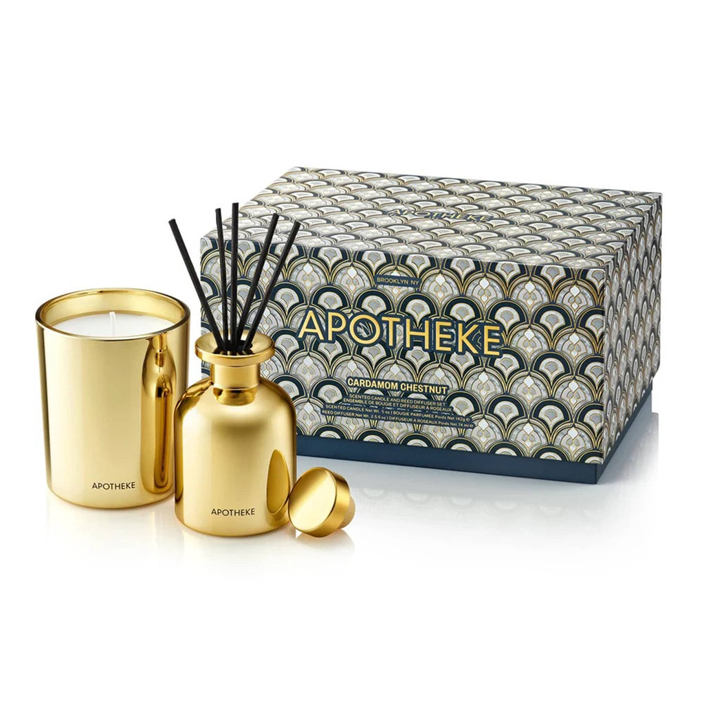 Apotheke Cardamom Chestnut scented limited edition mini gold candle and mini gold diffuser duo gift set with navy blue ad gray Art Deco pattern gift box.