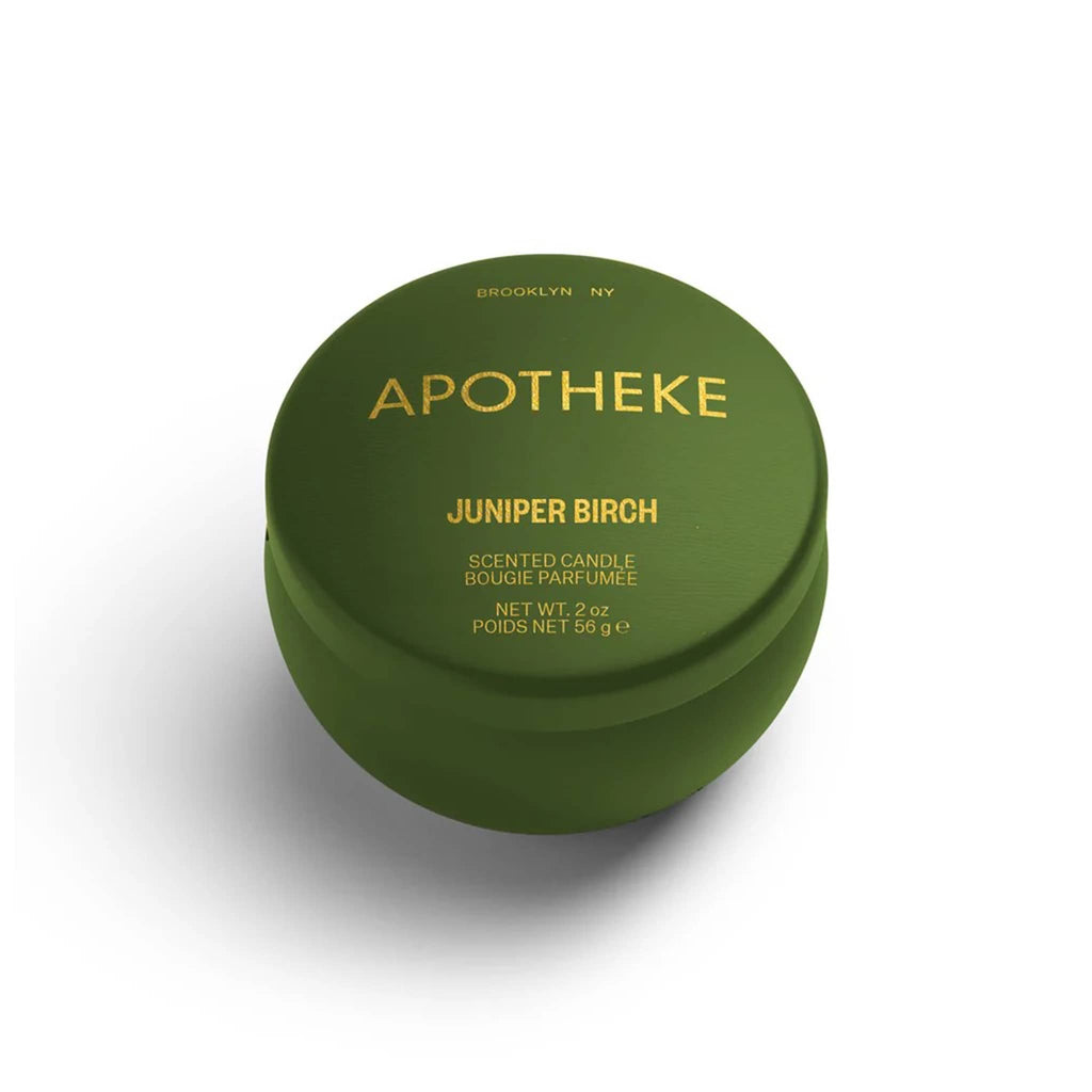 Apotheke Juniper Birch scented limited edition soy blend candle in dark olive green 2 ounce mini tin with lid.