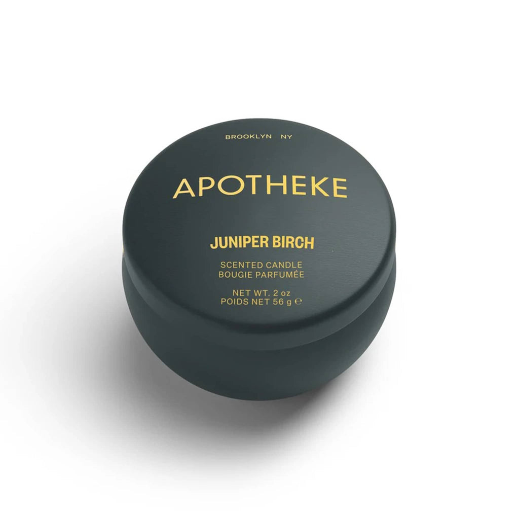 Apotheke Juniper Birch scented limited edition soy blend candle in dark olive green 2 ounce mini tin with lid.