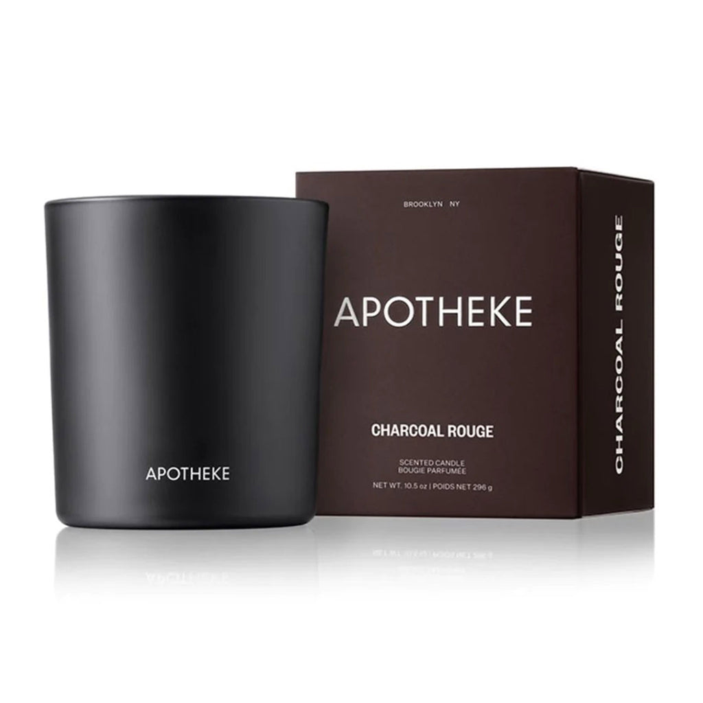 Apotheke Charcoal Rouge scented soy wax blend candle in matte black glass vessel with dark rouge hued gift box, front view.
