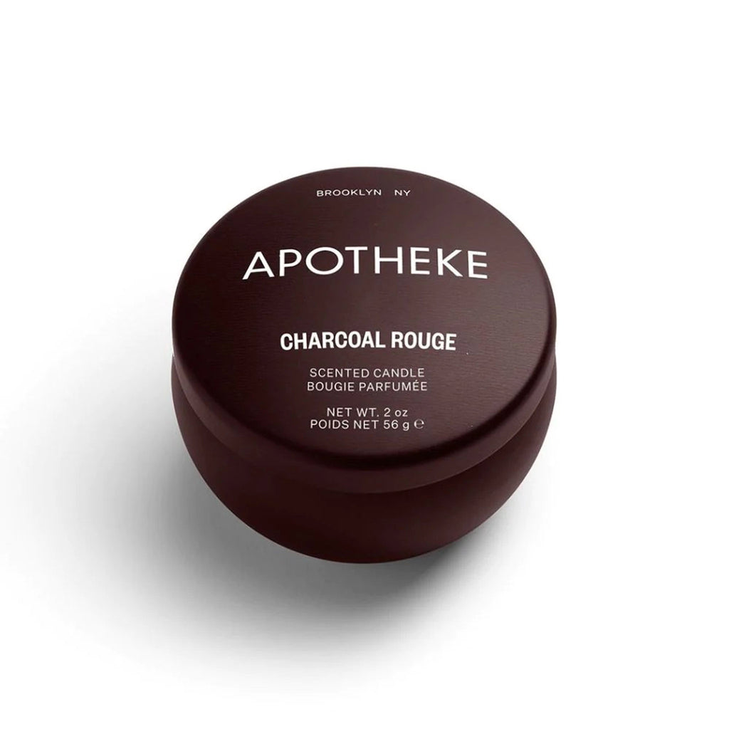 Apotheke Charcoal Rouge scented soy wax blend candle in dark rouge mini tin with lid on.