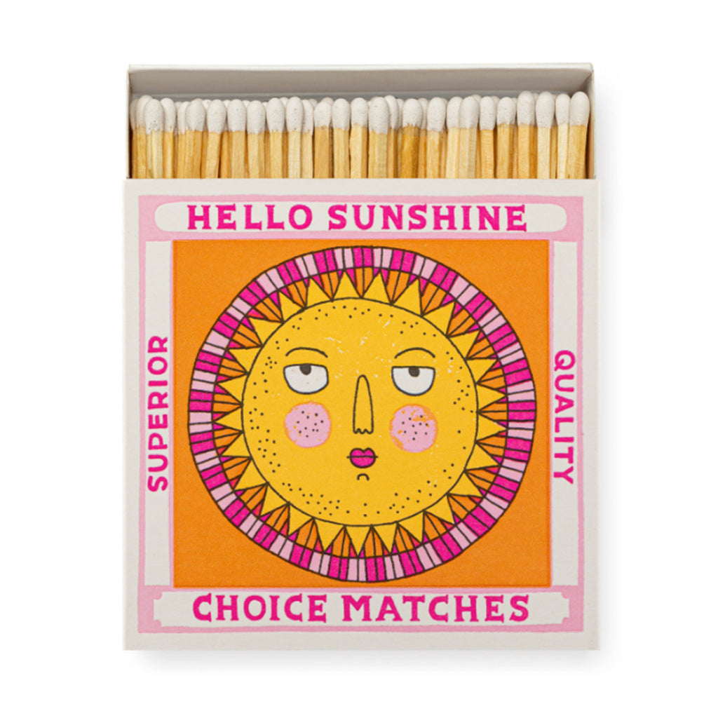 Archivist Gallery Hello Sunshine square match box with pink, orange and yellow sun illustration, slid open slightly to see white-tipped wood 4 inch matches inside.