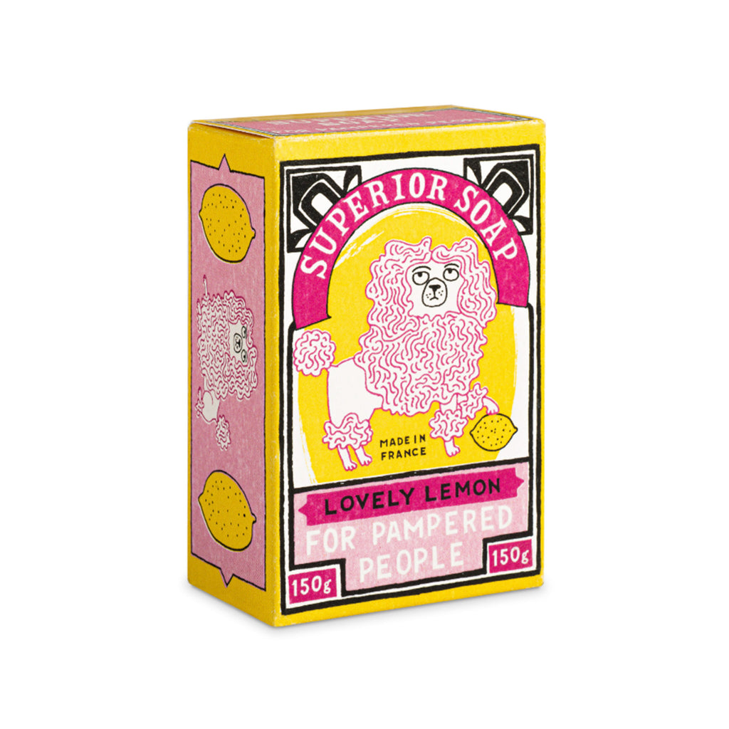 Archivist Gallery Lemon Scented hand bar soap with yellow box packaging with a pink poodle illustration, front angle.