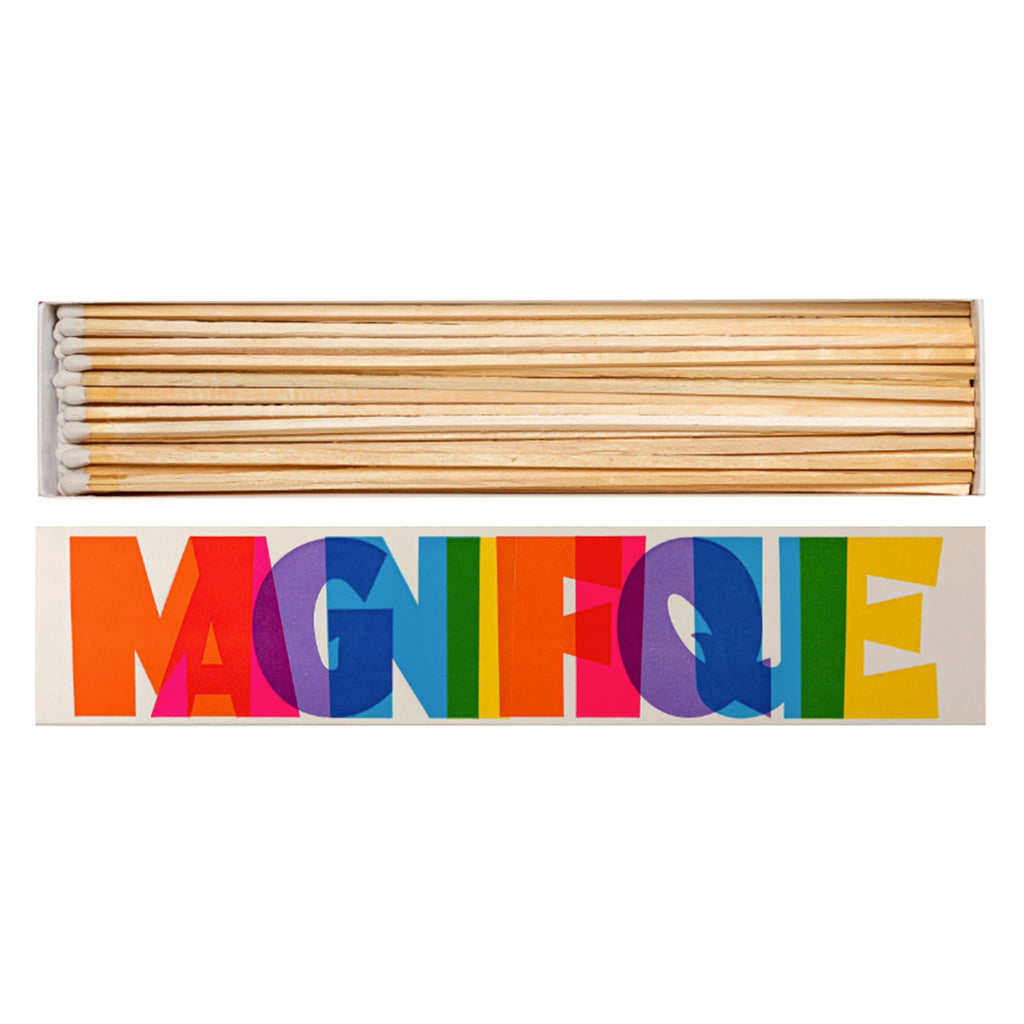 Archivist Gallery x Pressink long wooden safety matches in letterpress matchbox packaging with "magnifique" in rainbow colored letters.