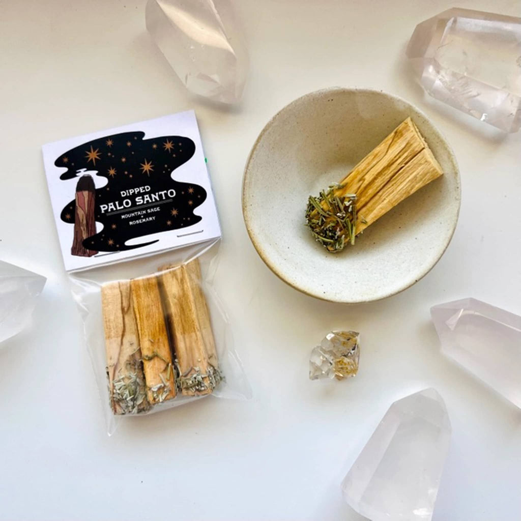 Ark Made Mountain Sage and Rosemary Dipped Palo Santo Sticks, pack of 3 in packaging with one in a bowl beside it, surrounded by crystals.